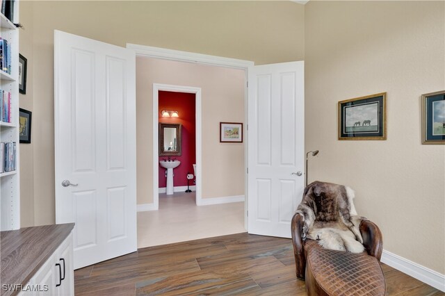 6528 Costa Cir, Naples, FL 34113 - living area with dark wood-type flooring and baseboards