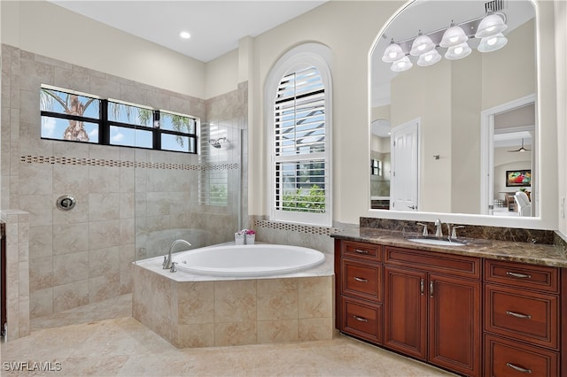 6528 Costa Cir, Naples, FL 34113 - full bathroom with vanity, a bath, a walk in shower, and tile patterned flooring