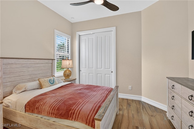 6528 Costa Cir, Naples, FL 34113 - bedroom featuring baseboards, a closet, dark wood-type flooring, and a ceiling fan
