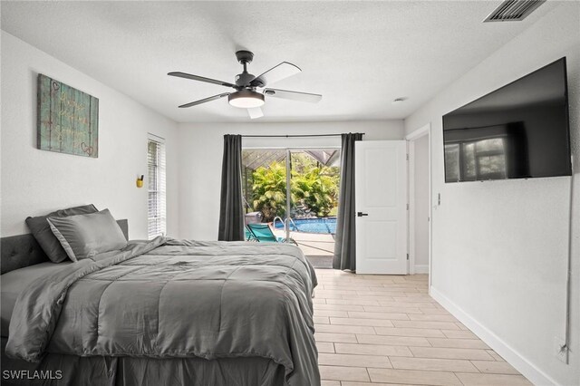 2001 Bahama Ave, Fort Myers, FL 33905 - bedroom with access to outside, baseboards, ceiling fan, and a textured ceiling