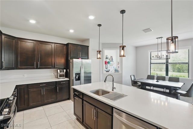 4934 Seton Way, Ave Maria, FL 34142 - kitchen featuring stainless steel appliances, a sink, light countertops, pendant lighting, and recessed lighting