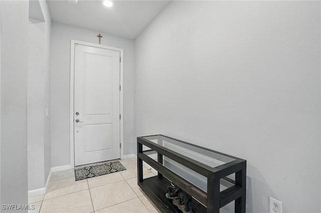4934 Seton Way, Ave Maria, FL 34142 - doorway featuring baseboards and light tile patterned floors