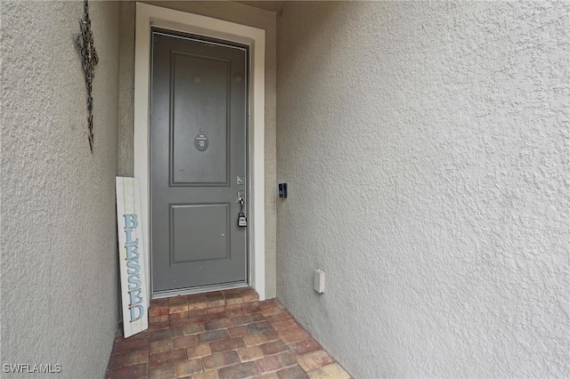4934 Seton Way, Ave Maria, FL 34142 - doorway to property featuring stucco siding