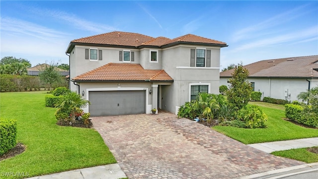 4934 Seton Way, Ave Maria, FL 34142 - mediterranean / spanish house featuring stucco siding, decorative driveway, a tiled roof, an attached garage, and a front lawn