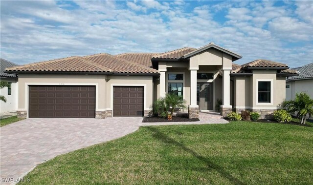 4426 Vasco St, Punta Gorda, FL 33950 - view of front of property with stucco siding, a garage, driveway, and stone siding