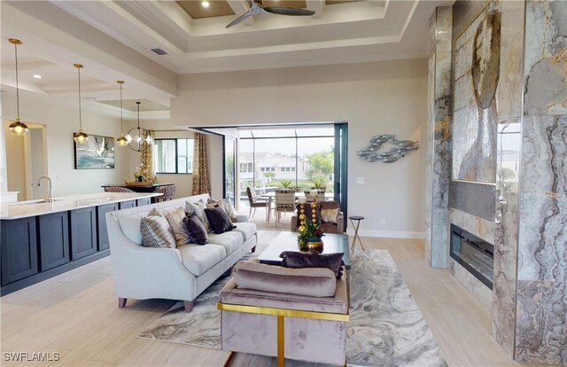 4426 Vasco St, Punta Gorda, FL 33950 - living room with ceiling fan, light wood-type flooring, coffered ceiling, healthy amount of natural light, and recessed lighting