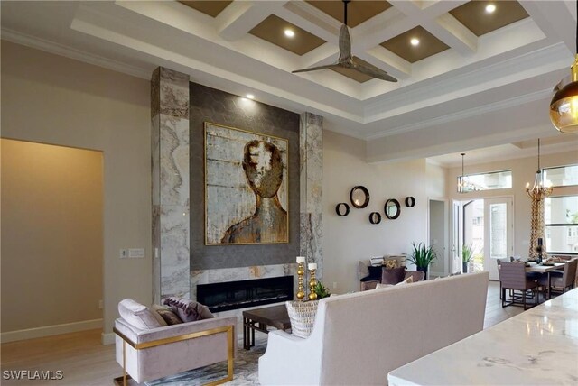 4426 Vasco St, Punta Gorda, FL 33950 - living area featuring a ceiling fan, a premium fireplace, light wood finished floors, crown molding, and beamed ceiling