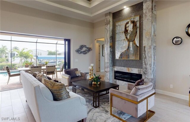 4426 Vasco St, Punta Gorda, FL 33950 - living area with a high ceiling, a premium fireplace, and baseboards