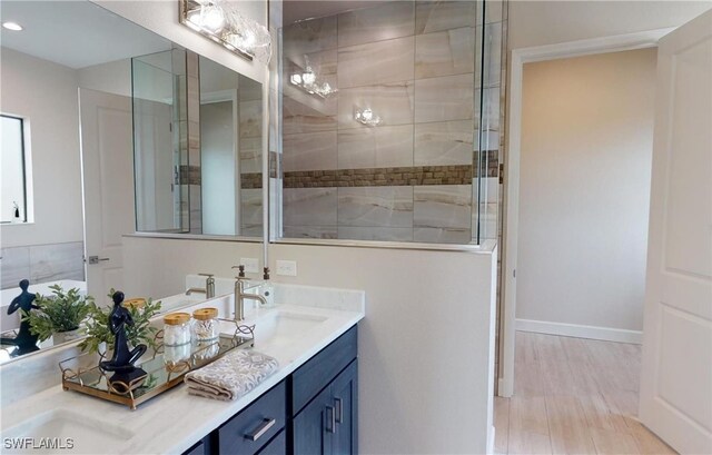 4426 Vasco St, Punta Gorda, FL 33950 - bathroom with double vanity, recessed lighting, baseboards, and a tile shower