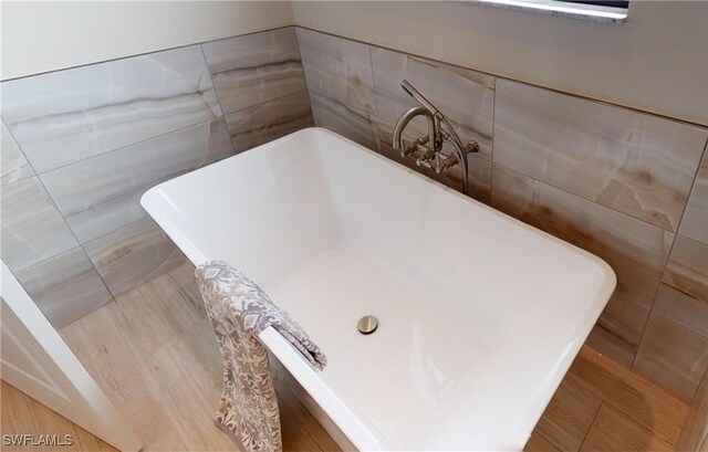 4426 Vasco St, Punta Gorda, FL 33950 - bathroom view of tile walls and a freestanding tub