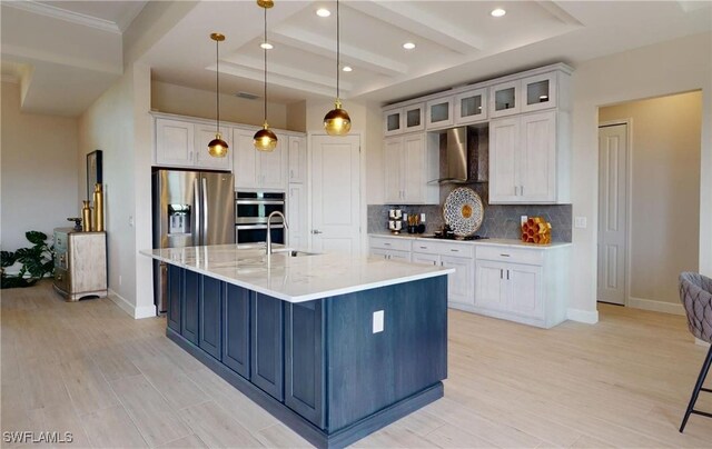 4426 Vasco St, Punta Gorda, FL 33950 - kitchen featuring wall chimney range hood, decorative backsplash, appliances with stainless steel finishes, white cabinets, and baseboards