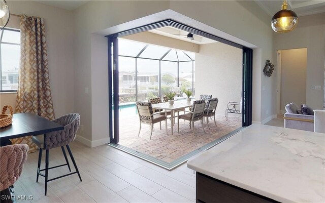 4426 Vasco St, Punta Gorda, FL 33950 - dining space featuring plenty of natural light, baseboards, crown molding, a sunroom, and a ceiling fan