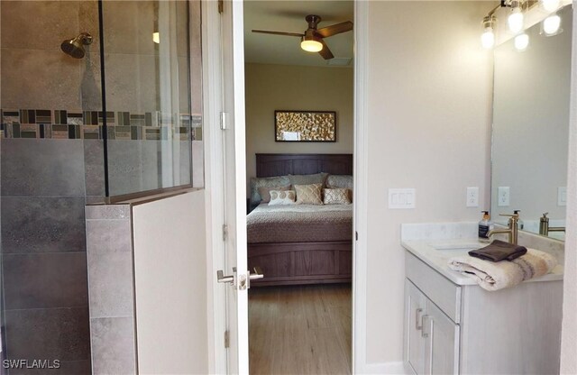 4426 Vasco St, Punta Gorda, FL 33950 - ensuite bathroom featuring a walk in shower, vanity, wood finished floors, and ceiling fan