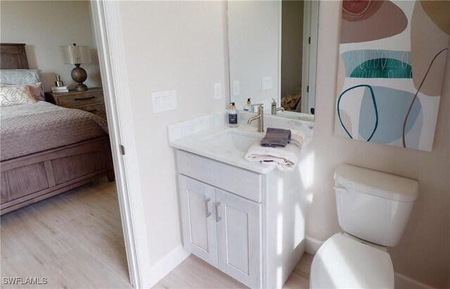 4426 Vasco St, Punta Gorda, FL 33950 - bathroom featuring ensuite bathroom, vanity, toilet, and baseboards