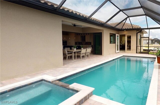 4426 Vasco St, Punta Gorda, FL 33950 - view of pool with a patio area, a pool with connected hot tub, ceiling fan, glass enclosure, and outdoor dining space