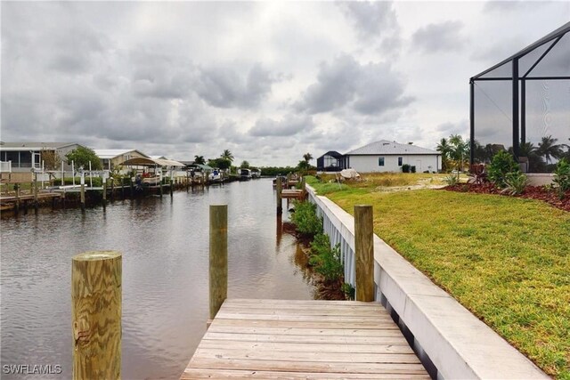 4426 Vasco St, Punta Gorda, FL 33950 - dock featuring a water view, a yard, and a lanai