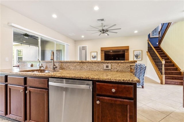 11164 Sparkleberry Dr, Fort Myers, FL 33913 - kitchen featuring stainless steel dishwasher, a ceiling fan, light stone countertops, light tile patterned floors, and recessed lighting