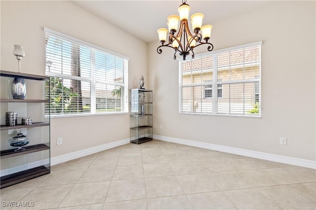11164 Sparkleberry Dr, Fort Myers, FL 33913 - unfurnished dining area with plenty of natural light, a chandelier, and baseboards