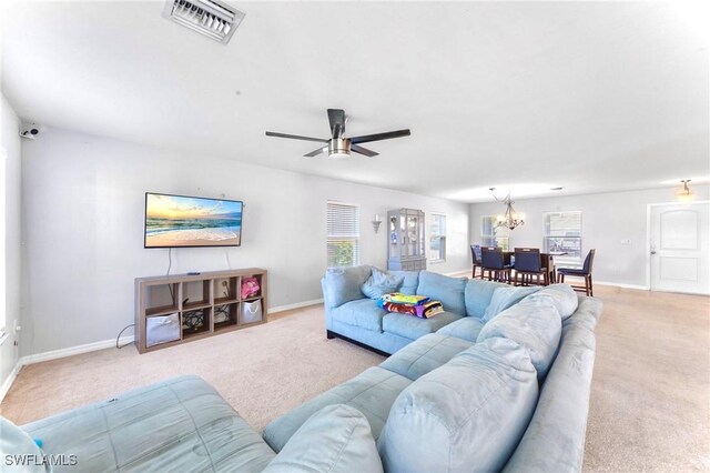 10329 Canal Brook Ln, Lehigh Acres, FL 33936 - living area with carpet floors, a chandelier, baseboards, and ceiling fan