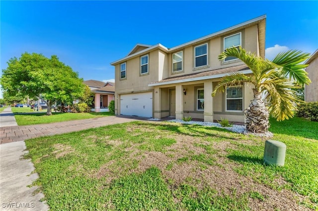 10329 Canal Brook Ln, Lehigh Acres, FL 33936 - traditional-style house with stucco siding, an attached garage, driveway, and a front lawn