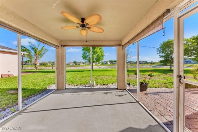 10329 Canal Brook Ln, Lehigh Acres, FL 33936 - unfurnished sunroom with a ceiling fan and healthy amount of natural light