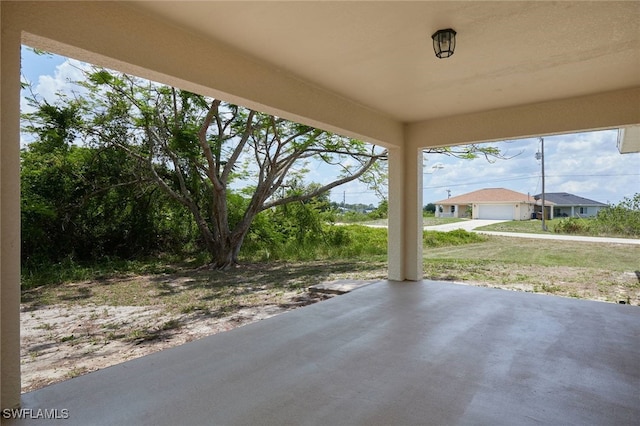 314 Pennfield St, Lehigh Acres, FL 33974 - view of patio / terrace featuring a detached garage