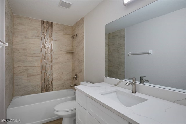 314 Pennfield St, Lehigh Acres, FL 33974 - full bathroom with toilet, vanity, and shower / tub combination
