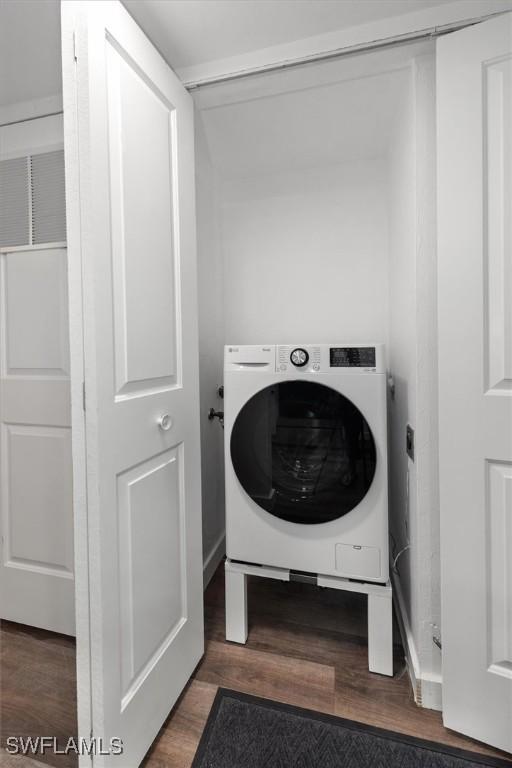 499 Forest Lakes Blvd Unit 306, Naples, FL 34105 - laundry room with washer / clothes dryer and wood finished floors