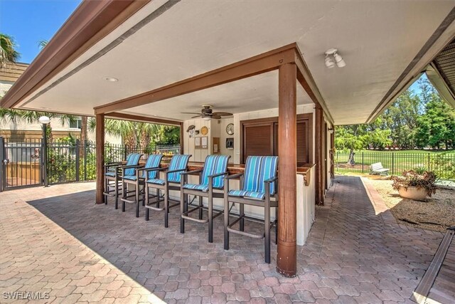 499 Forest Lakes Blvd Unit 306, Naples, FL 34105 - view of patio / terrace featuring ceiling fan
