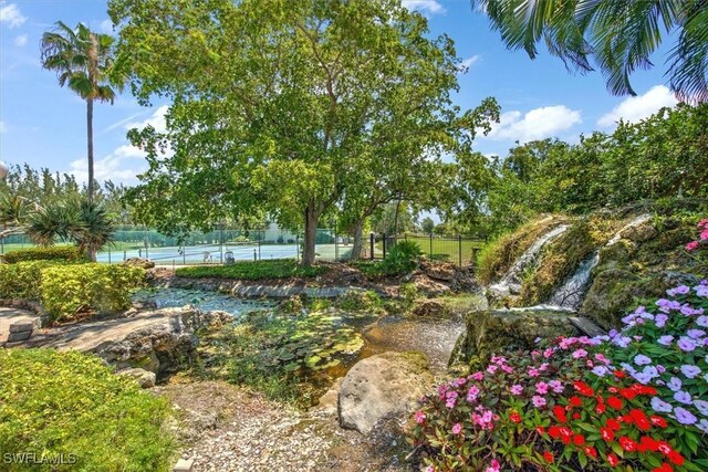 499 Forest Lakes Blvd Unit 306, Naples, FL 34105 - view of home's community with a tennis court