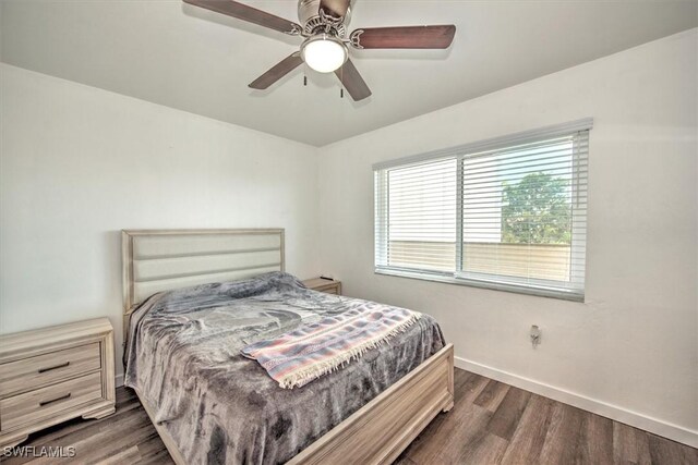 499 Forest Lakes Blvd Unit 306, Naples, FL 34105 - bedroom featuring dark wood-style floors, baseboards, and ceiling fan