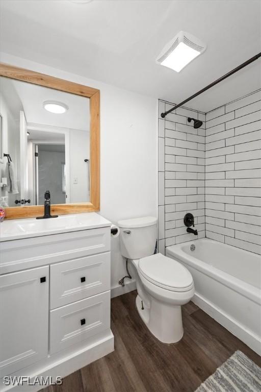 499 Forest Lakes Blvd Unit 306, Naples, FL 34105 - full bath with toilet, wood finished floors, vanity, and shower / bathtub combination