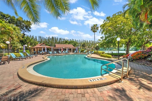 499 Forest Lakes Blvd Unit 306, Naples, FL 34105 - community pool with a patio area