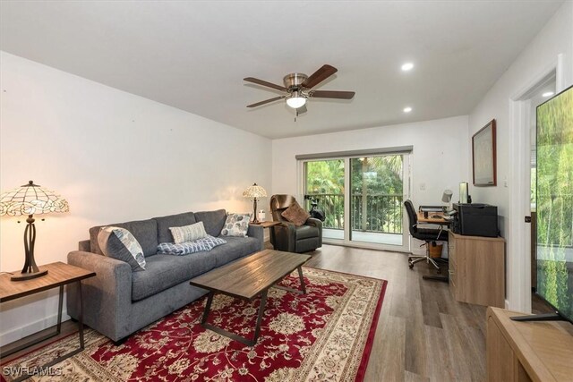 499 Forest Lakes Blvd Unit 306, Naples, FL 34105 - living room featuring a desk, ceiling fan, wood finished floors, and recessed lighting
