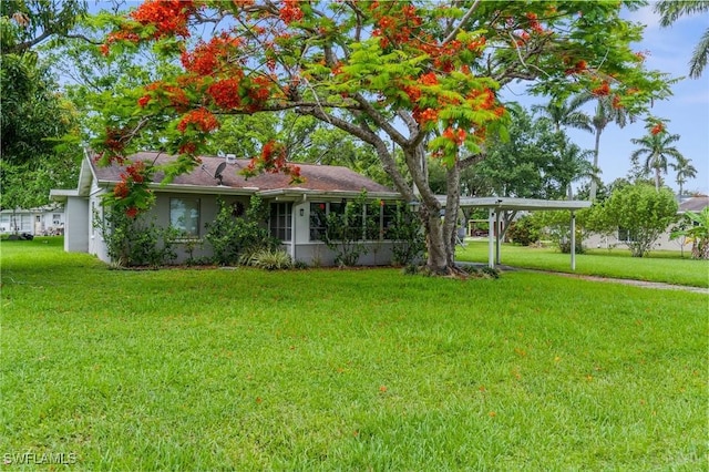 322 New York Dr, Fort Myers, FL 33905 - view of front facade with a front yard and stucco siding