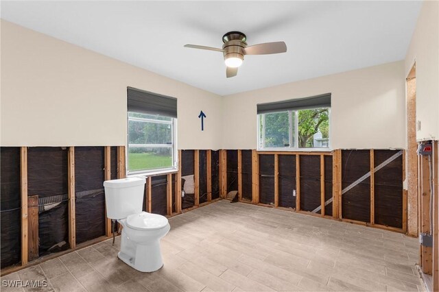 322 New York Dr, Fort Myers, FL 33905 - bathroom with toilet, a ceiling fan, and wood finished floors