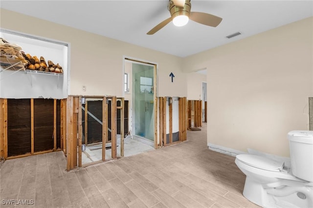322 New York Dr, Fort Myers, FL 33905 - bathroom with wood finished floors, a ceiling fan, and toilet