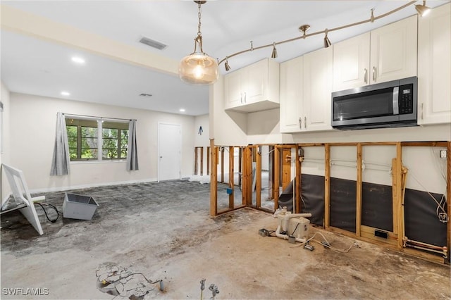 322 New York Dr, Fort Myers, FL 33905 - kitchen featuring stainless steel microwave, hanging light fixtures, white cabinets, and recessed lighting