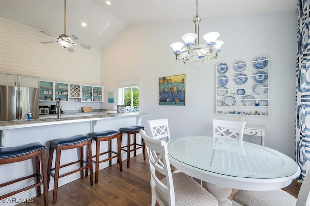 2250 SE 28th St, Cape Coral, FL 33904 - dining room with high vaulted ceiling, dark wood-style flooring, a chandelier, a ceiling fan, and recessed lighting