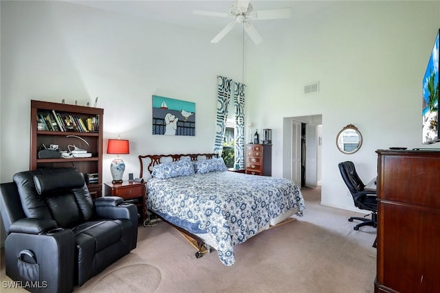 2250 SE 28th St, Cape Coral, FL 33904 - carpeted bedroom with an office area, a towering ceiling, and a ceiling fan