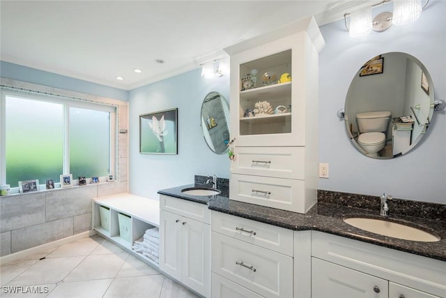 2250 SE 28th St, Cape Coral, FL 33904 - full bath featuring double vanity, tile patterned floors, toilet, crown molding, and recessed lighting