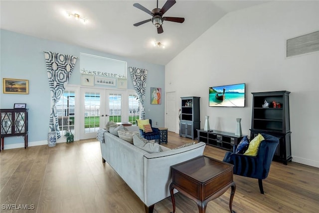 2250 SE 28th St, Cape Coral, FL 33904 - living room featuring high vaulted ceiling, french doors, ceiling fan, wood finished floors, and baseboards