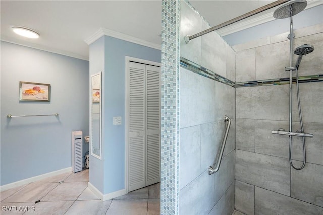 2250 SE 28th St, Cape Coral, FL 33904 - bathroom with crown molding, a tile shower, a closet, tile patterned floors, and baseboards
