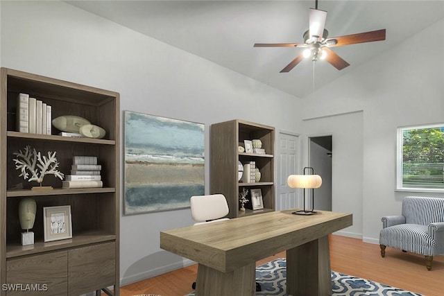 2250 SE 28th St, Cape Coral, FL 33904 - home office with wood finished floors, ceiling fan, vaulted ceiling, and baseboards