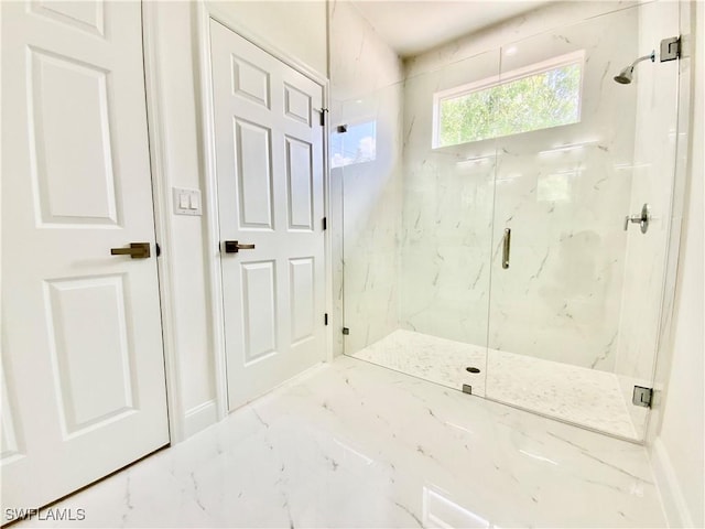 2710 21st St W, Lehigh Acres, FL 33971 - bathroom featuring marble finish flooring, a marble finish shower, and baseboards
