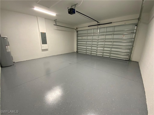 2710 21st St W, Lehigh Acres, FL 33971 - garage with a garage door opener, electric panel, and electric water heater