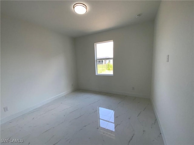 2710 21st St W, Lehigh Acres, FL 33971 - spare room with baseboards and marble finish flooring