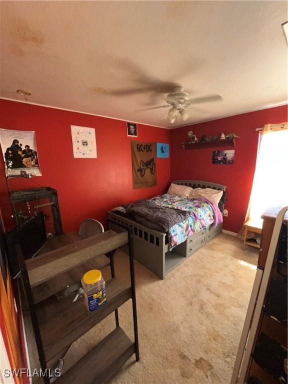 4767/4765 22nd St SW, Lehigh Acres, FL 33973 - carpeted bedroom featuring ceiling fan