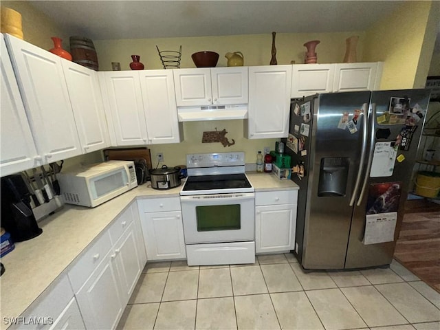 4767/4765 22nd St SW, Lehigh Acres, FL 33973 - kitchen with white appliances, under cabinet range hood, light countertops, and white cabinets
