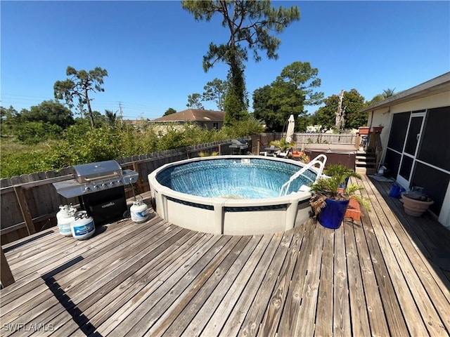 4767/4765 22nd St SW, Lehigh Acres, FL 33973 - view of swimming pool with a deck and a fenced backyard